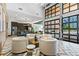 Bright and open lounge area with modern furniture, a well-equipped kitchen, and city views at 775 Juniper Ne St # 210, Atlanta, GA 30308