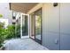 Private patio with a tiled floor, offering a quiet outdoor space with sliding glass doors for indoor-outdoor living at 775 Juniper Ne St # 210, Atlanta, GA 30308