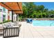 Relaxing outdoor pool area with comfortable lounge seating and a convenient pool lift for accessibility at 775 Juniper Ne St # 210, Atlanta, GA 30308