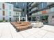 Resort-style pool area with plenty of lounge chairs and a built-in grill, perfect for outdoor entertainment and relaxation at 775 Juniper Ne St # 210, Atlanta, GA 30308
