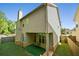 View of the backyard featuring a covered patio and fenced yard at 2550 Trelipe Dr, Lawrenceville, GA 30044