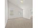Bright bedroom with neutral carpet and two windows for natural light at 2550 Trelipe Dr, Lawrenceville, GA 30044