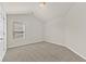 Cozy carpeted bedroom features a window with blinds and neutral paint for a calm atmosphere at 2550 Trelipe Dr, Lawrenceville, GA 30044