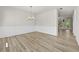 Bright dining room with hardwood floors, wainscoting, chandelier and a door to the outside at 2550 Trelipe Dr, Lawrenceville, GA 30044
