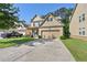 Charming two-story home with a brick front, inviting entrance, and a two car garage at 2550 Trelipe Dr, Lawrenceville, GA 30044