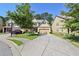 Charming two-story home with a brick front, inviting entrance, and a two car garage at 2550 Trelipe Dr, Lawrenceville, GA 30044