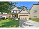 Charming two-story home with a brick front, inviting entrance, and a two car garage at 2550 Trelipe Dr, Lawrenceville, GA 30044