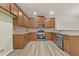 Spacious kitchen with stainless steel appliances, granite countertops, and hardwood floors at 2550 Trelipe Dr, Lawrenceville, GA 30044