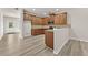 Bright kitchen features wood cabinets, granite countertops, and stainless steel microwave at 2550 Trelipe Dr, Lawrenceville, GA 30044