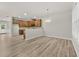Open floor plan connects kitchen and dining area with wood-look floors at 2550 Trelipe Dr, Lawrenceville, GA 30044