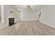Spacious living room with a cozy fireplace and natural lighting at 2550 Trelipe Dr, Lawrenceville, GA 30044