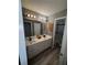 Updated bathroom with double sinks, and glass-enclosed shower at 458 Vinings Vintage Cir, Mableton, GA 30126