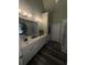 Bathroom featuring double sinks and a large mirror at 458 Vinings Vintage Cir, Mableton, GA 30126