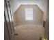 Cozy bedroom with sloped ceilings and natural light from a large window at 458 Vinings Vintage Cir, Mableton, GA 30126