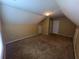 Unique bedroom with sloped ceiling, neutral paint, and carpet at 458 Vinings Vintage Cir, Mableton, GA 30126