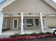 Welcoming clubhouse exterior featuring covered entryway at 458 Vinings Vintage Cir, Mableton, GA 30126