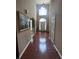 Long entryway featuring hard wood flooring and arched doorway at 458 Vinings Vintage Cir, Mableton, GA 30126