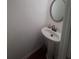 Stylish half bathroom with pedestal sink and modern faucet at 458 Vinings Vintage Cir, Mableton, GA 30126