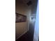 Hallway leading to main bedroom with carpet and modern painting hanging on the wall at 458 Vinings Vintage Cir, Mableton, GA 30126
