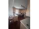 Well-lit kitchen features countertops, stainless steel appliances, breakfast bar, and ample cabinet space at 458 Vinings Vintage Cir, Mableton, GA 30126