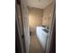 Convenient laundry room with modern, white washer and dryer set at 458 Vinings Vintage Cir, Mableton, GA 30126