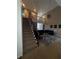 Open living area with high ceilings, a staircase, and a zebra print rug at 458 Vinings Vintage Cir, Mableton, GA 30126