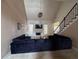 Open-concept living room with fireplace, large windows and dark blue sofa at 458 Vinings Vintage Cir, Mableton, GA 30126