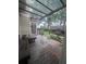 Covered back patio with wooden bench, room for seating and plants, and nice privacy fence at 458 Vinings Vintage Cir, Mableton, GA 30126