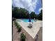 Relaxing community pool area with ample lounge chairs at 458 Vinings Vintage Cir, Mableton, GA 30126