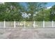 Scenic view from a backyard deck overlooking lush greenery and a tranquil pond, perfect for outdoor enjoyment at 528 Savannah Rose Way, Lawrenceville, GA 30045