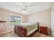 Comfortable bedroom with neutral tones and a cozy carpet at 528 Savannah Rose Way, Lawrenceville, GA 30045