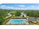 Aerial view of the community pool and surrounding landscaping at 528 Savannah Rose Way, Lawrenceville, GA 30045