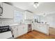 Bright kitchen with stainless steel appliances and wooden flooring at 528 Savannah Rose Way, Lawrenceville, GA 30045