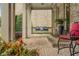 Relaxing front porch with a swing, comfortable seating, and a tranquil atmosphere at 5605 Copper Creek Pass, Cumming, GA 30040