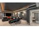 Basement home theater with comfortable seating, a large screen, and moody lighting at 5605 Copper Creek Pass, Cumming, GA 30040