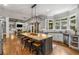Open concept kitchen with a large center island, stainless steel appliances, and lots of natural light at 5605 Copper Creek Pass, Cumming, GA 30040