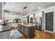 Gourmet kitchen featuring a large island, stainless steel appliances, and custom cabinetry and eat in breakfast area at 5605 Copper Creek Pass, Cumming, GA 30040