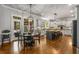 Spacious kitchen with a large center island and breakfast bar, with an adjacent outdoor porch at 5605 Copper Creek Pass, Cumming, GA 30040
