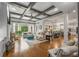 Open-concept space with coffered ceilings, large windows, and seamless flow to the kitchen area at 5605 Copper Creek Pass, Cumming, GA 30040