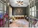 Charming playroom with elegant wainscoting, decorated with playful ' toys and bright patterned rug at 5605 Copper Creek Pass, Cumming, GA 30040