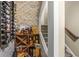 Charming wine cellar featuring ample storage, brick wall, and shelving for bottles and accessories at 5605 Copper Creek Pass, Cumming, GA 30040