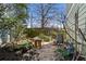Secluded backyard featuring a rock garden, bench, and mature trees providing shade and privacy at 735 Ponce De Leon Pl Ne Unit 1, Atlanta, GA 30306