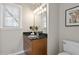 Well-lit bathroom showcasing a modern vanity with marble countertop and a sleek, updated design at 735 Ponce De Leon Pl Ne Unit 1, Atlanta, GA 30306