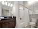 Bathroom featuring granite vanity and tiled shower at 735 Ponce De Leon Pl Ne Unit 1, Atlanta, GA 30306