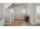 Bright entryway with hardwood floors, staircase, and natural light streaming through the windows at 735 Ponce De Leon Pl Ne Unit 1, Atlanta, GA 30306