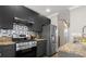 Sleek kitchen design showcasing modern appliances, granite countertops, and stylish cabinetry, perfect for cooking and entertaining at 735 Ponce De Leon Pl Ne Unit 1, Atlanta, GA 30306