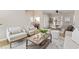Open-concept living room and dining area featuring a neutral color palette and hardwood floors at 735 Ponce De Leon Pl Ne Unit 1, Atlanta, GA 30306