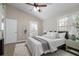 This main bedroom features a ceiling fan, ensuite, and access to the backyard at 735 Ponce De Leon Pl Ne Unit 1, Atlanta, GA 30306