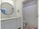 Bright bathroom with a large mirror and shower featuring a shower curtain at 302 Boxwood Ln, Roswell, GA 30075