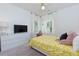 Bedroom with shuttered windows, desk and TV at 302 Boxwood Ln, Roswell, GA 30075
